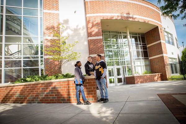 students talking on campus